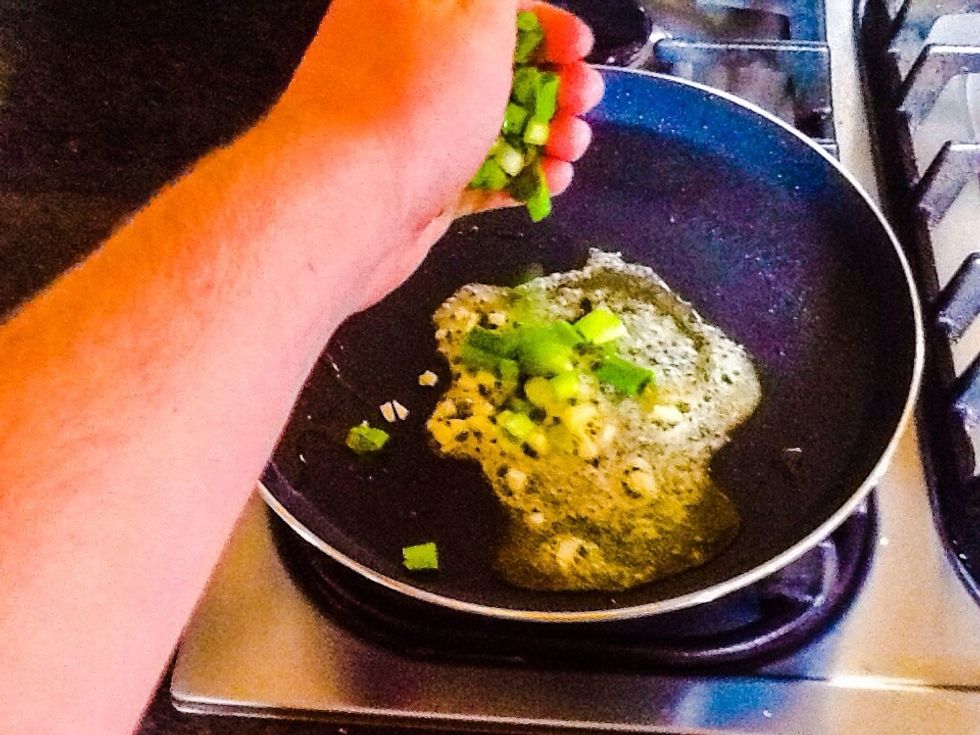 Then add chopped spring onions