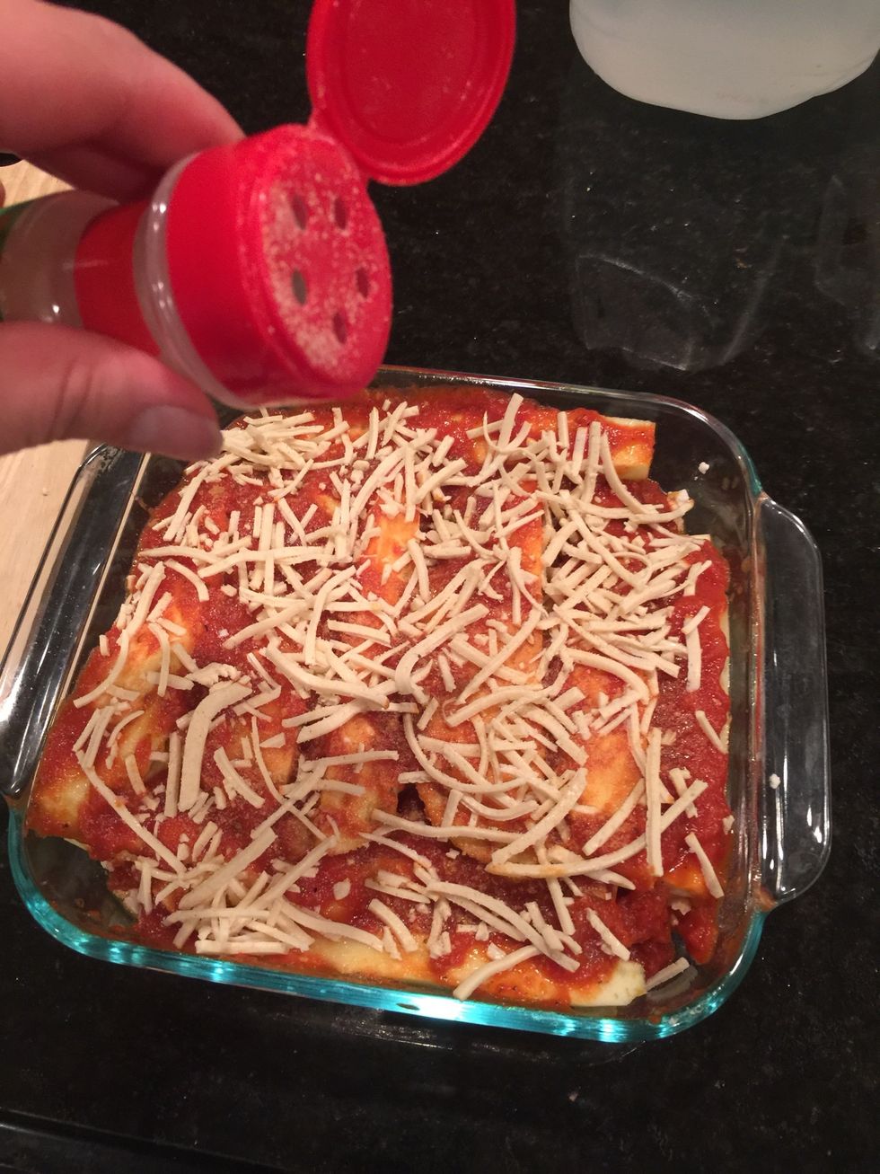 Then add eggplant layer, nutritional yeast, pasta sauce, vegan mozzarella cheese and onion garlic black pepper mix.