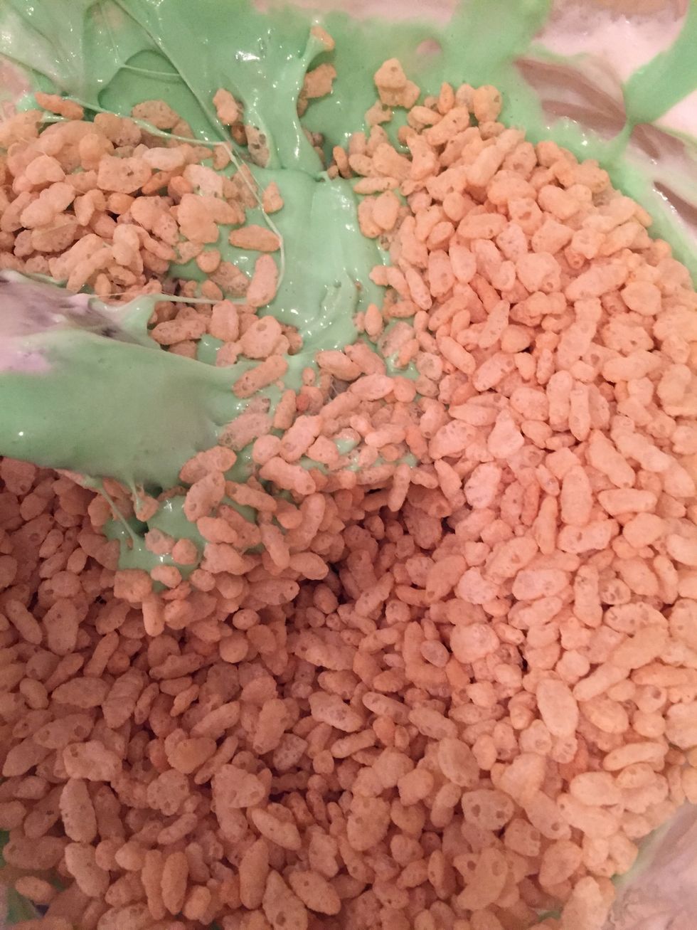 Then add in 1/3 of the Rice Krispies to the green marshmallow.