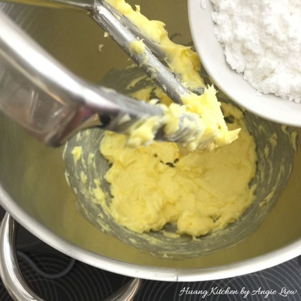 Then add in icing sugar (powdered sugar). Beat butter and sugar until light and fluffy, about 3 to 5 minutes. Scape down the sides and bottom of bowl occasionally throughout the entire mixing process.