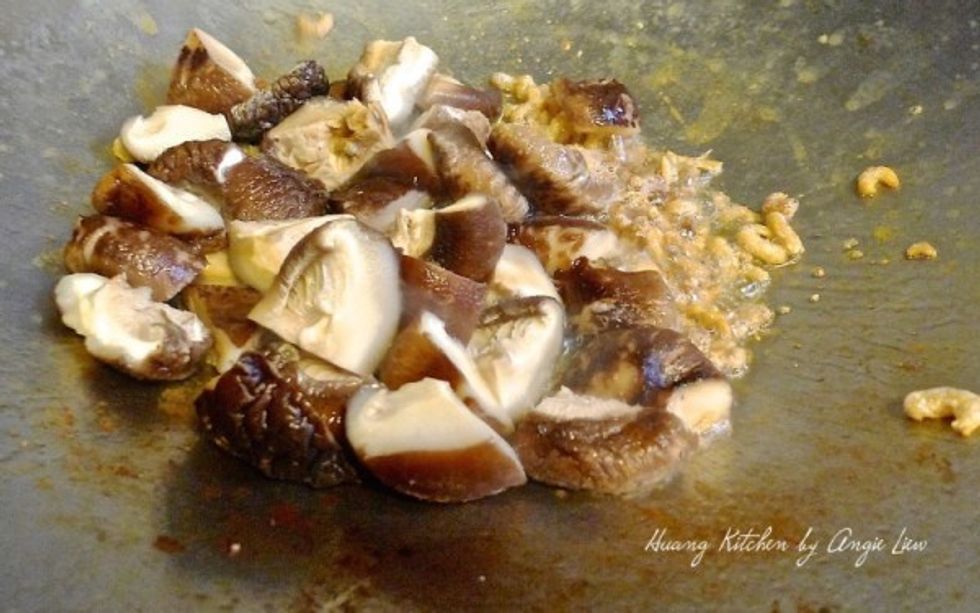 Then add in shitake mushrooms. Fry for a few minutes.
