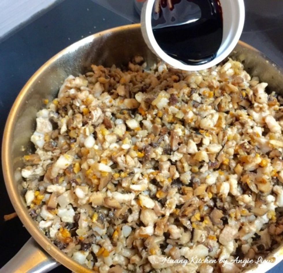 Then add in the chopped pork lard and dark soy sauce. Stir to evenly mixed all ingredients.