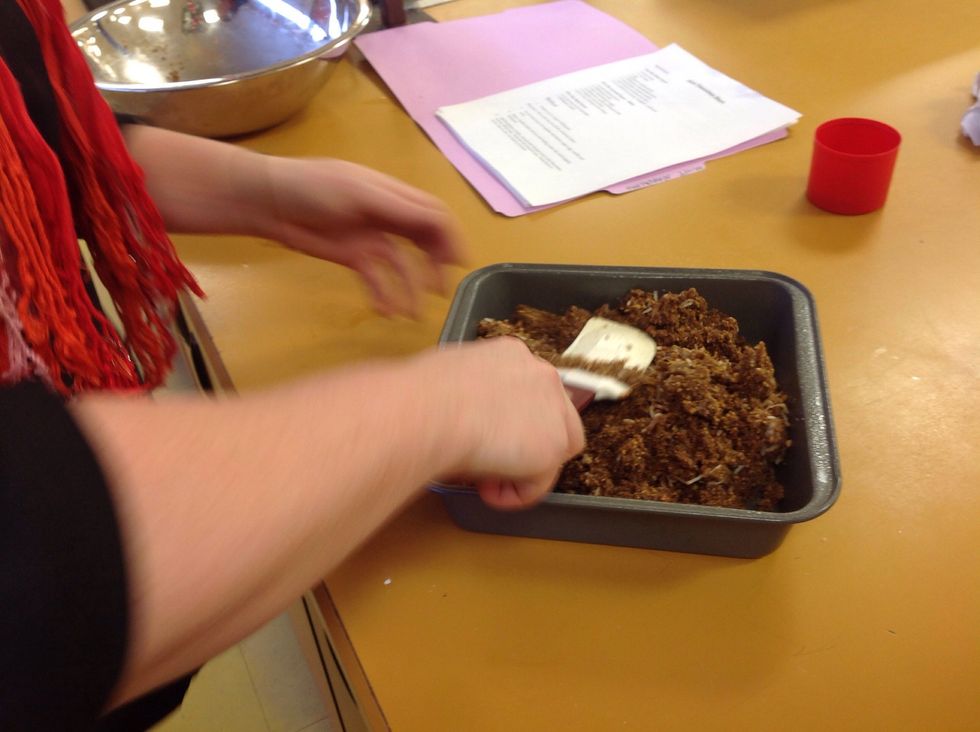 Then add in the crumb mix and press it down in the pan. This mixture will only go on the bottom and not up on the sides.