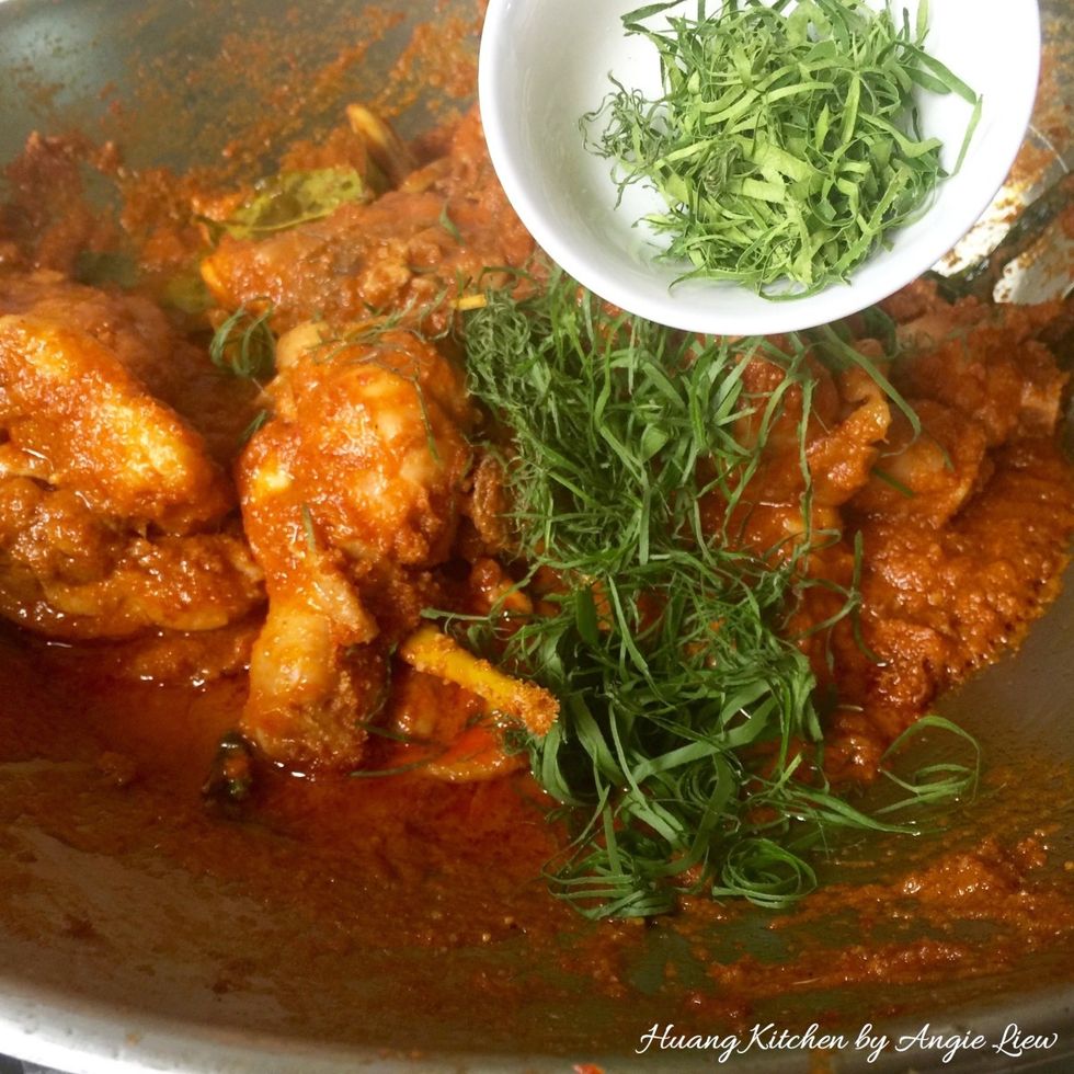 Then add in the finely shredded kaffir and turmeric leaves.