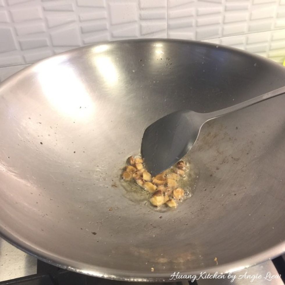 Then add in the minced mushroom stems and stir fry till aromatic, about 2 minutes.