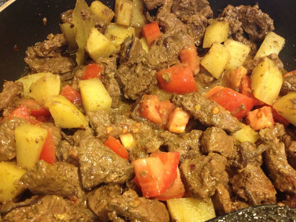 Then, add in the tomatoes.