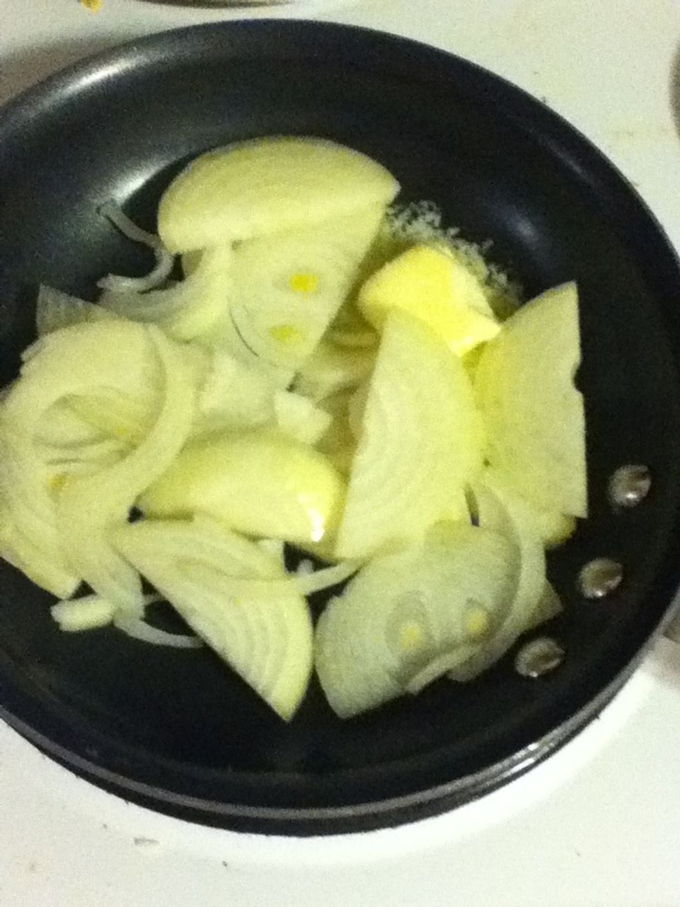 Then add one onion chopped into ribbons, plus a heaping quarter tsp salt, and let it work until it starts to brown.