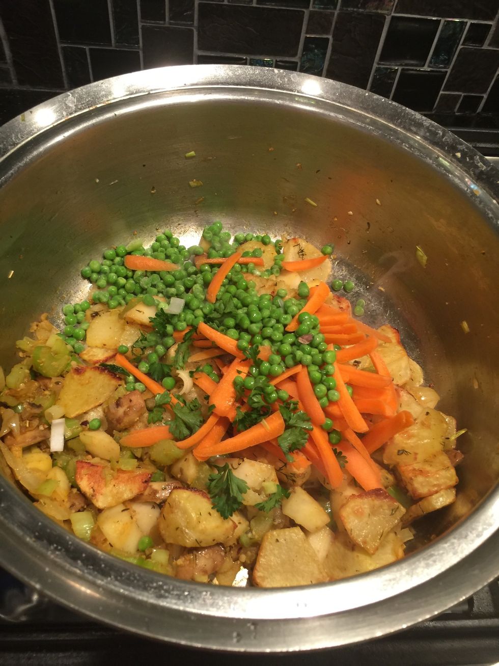 Then add peas and carrots.