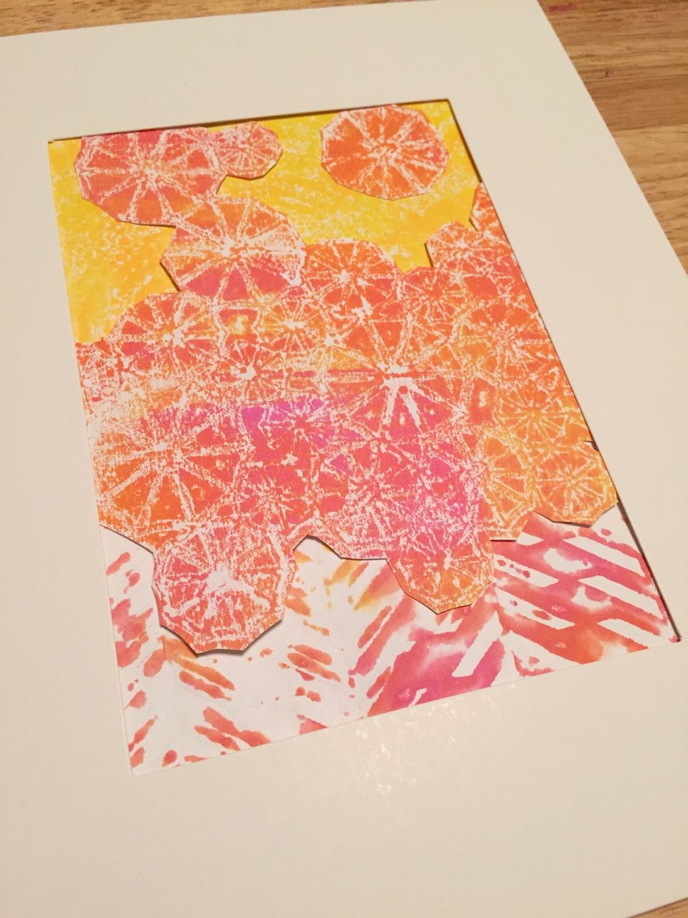 then add print made using paper towel to top of collage. a few cut out parasols were added on top of yellow.