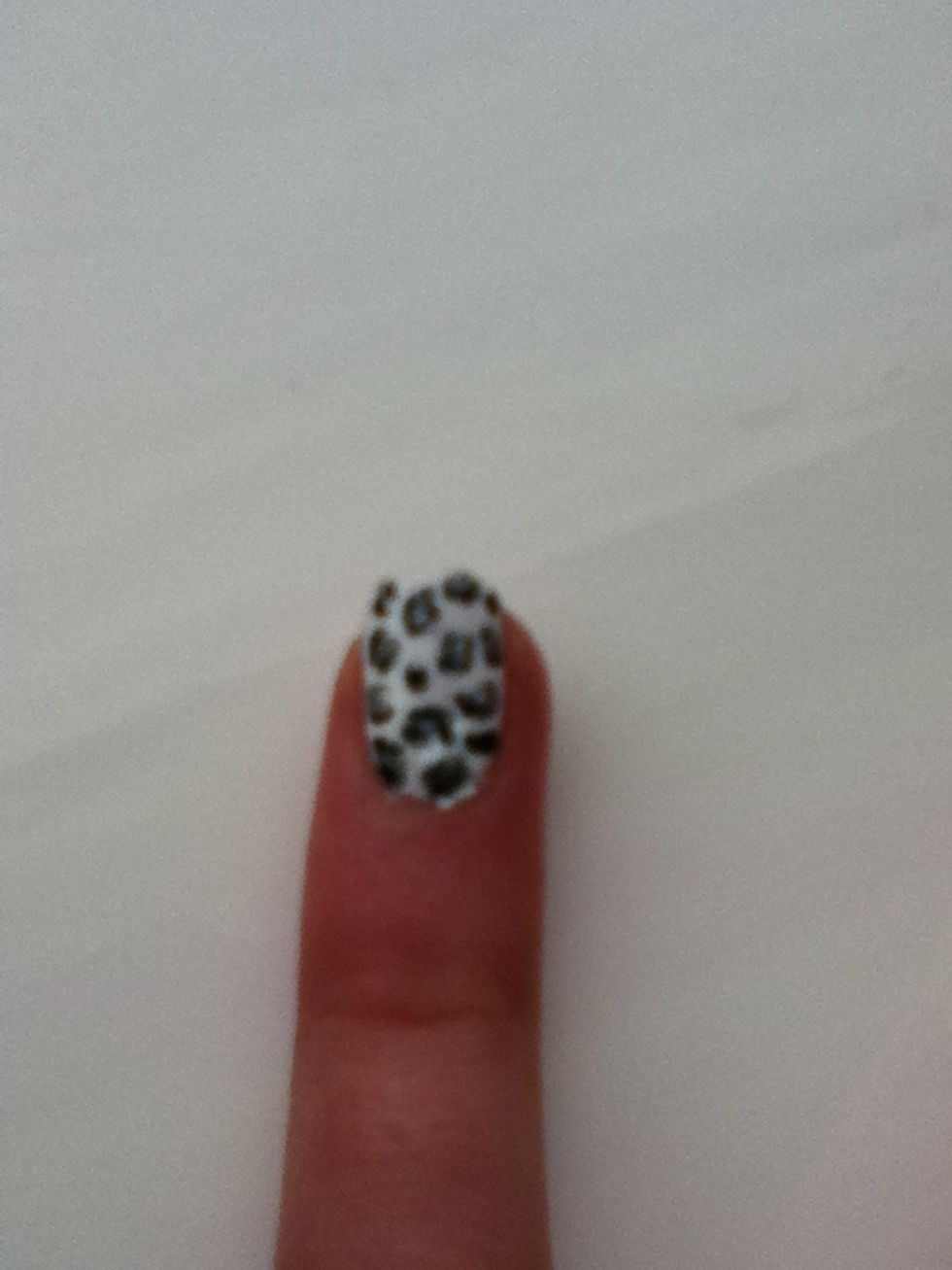 Then add random dots of silver all over. Line the dots with a black nail pen, but only lining the sides of the dots. It takes a long time, but be patient :) finished!