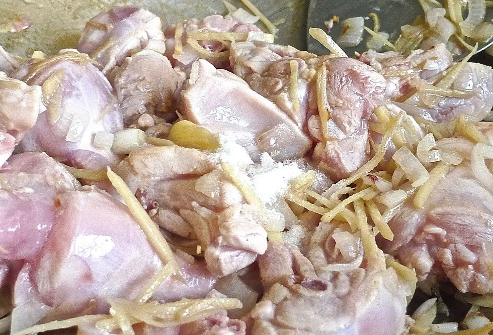 Then add salt to taste. Stir fry until chicken is brown.