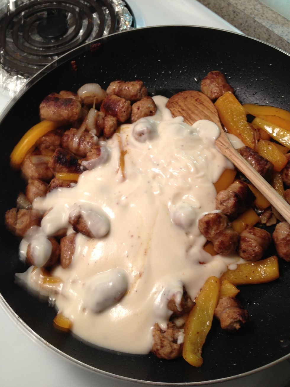 Then add sauce. Stir in and leave