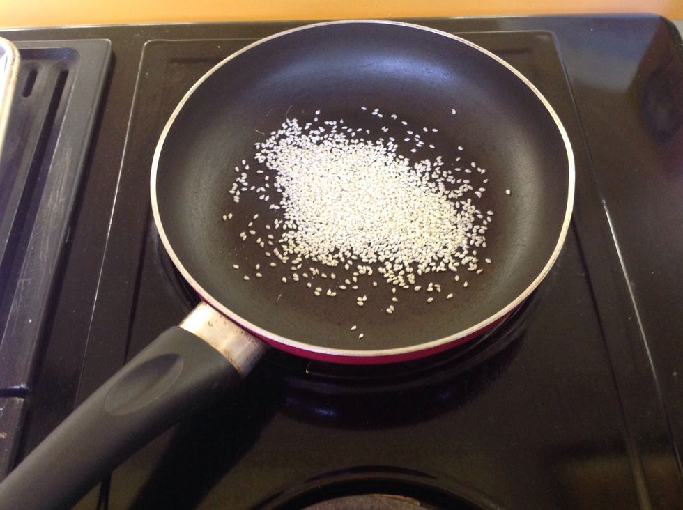 Then add sesame seeds and stir constantly until the seeds are golden brown.