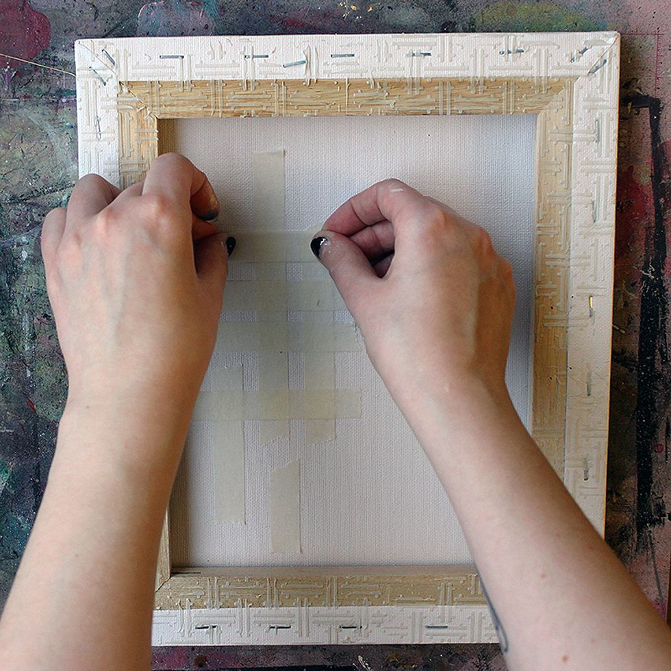 Then add some masking tape to the canvas to create a little texture to the background.