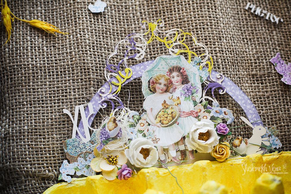 Then add some middle size paper flowers, chipboards and cut designs.