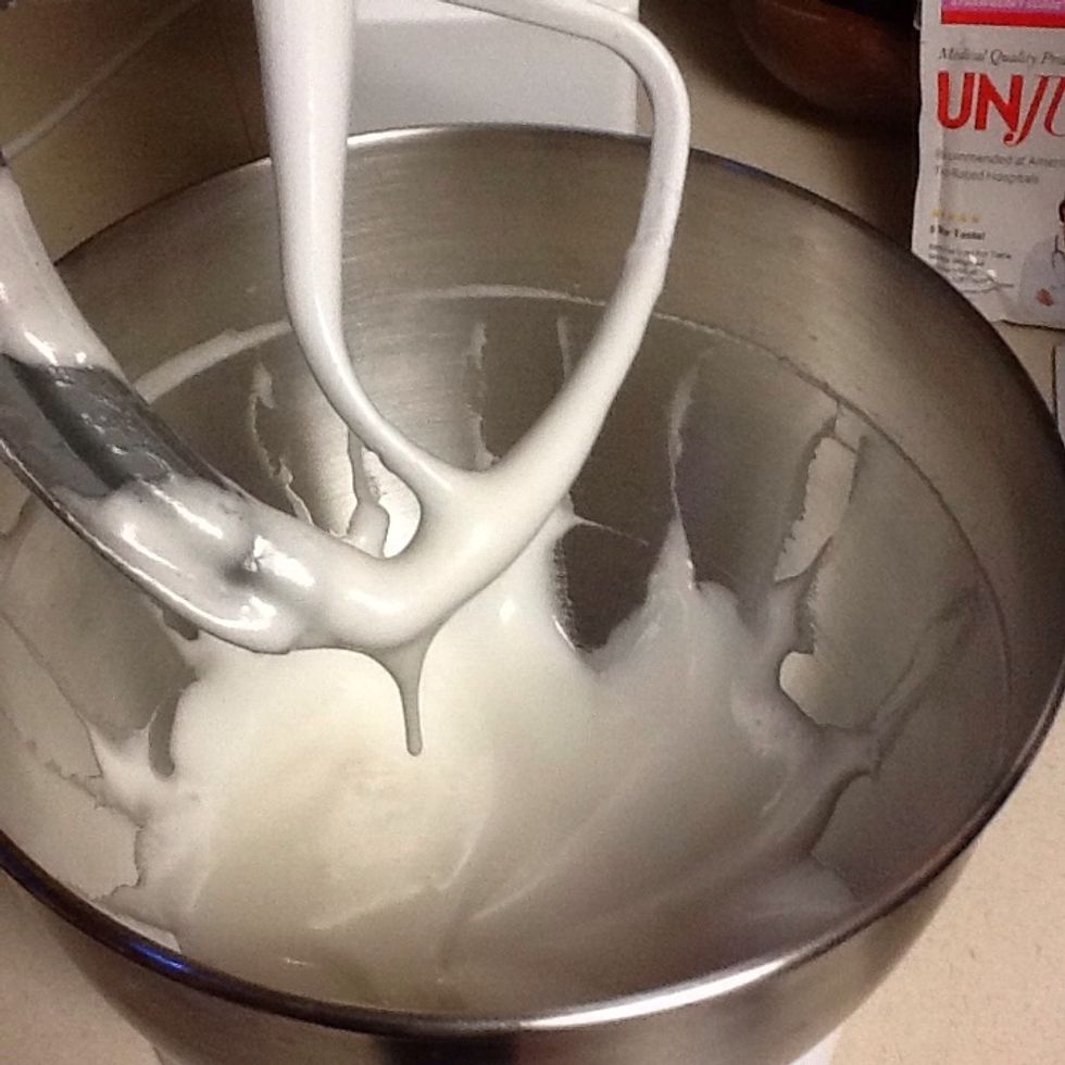 Then add superfine sugar into beaten egg whites. Whip until peaks are stiff.