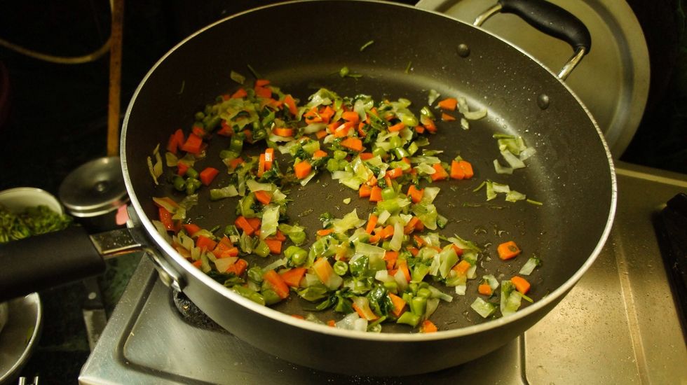 Then add the boiled vegetables (carrot, French beans, cabbage and coriander leaves) and fry for 2 mins... (Add a pinch of salt to it )