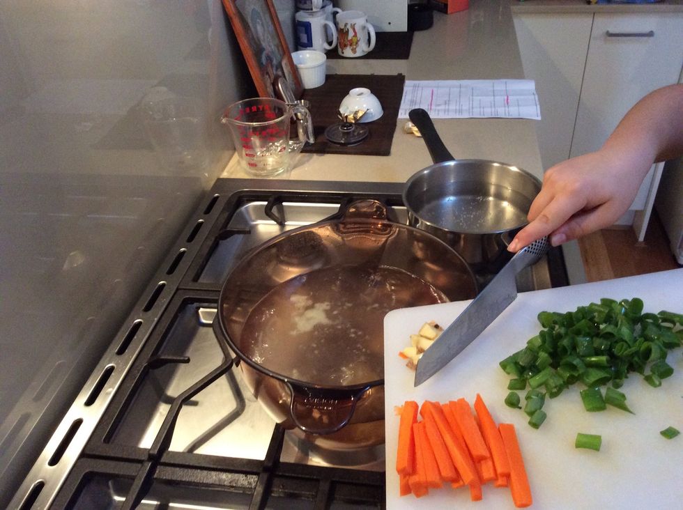 Then Add the carrots, onions and fish