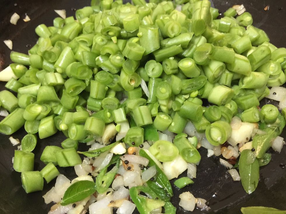 Then add the chopped French beans and mix it thoroughly