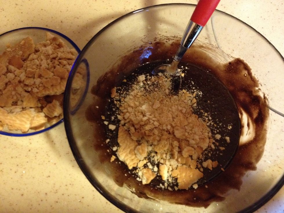 Then add the crumbled biscuits to the mixture and mix them like a dough.