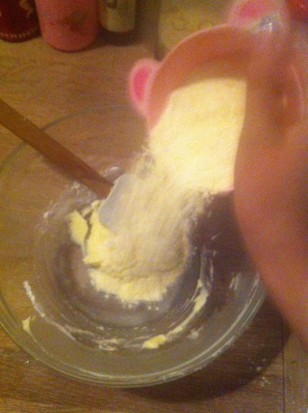 Then add the flour ( 1/5 at the time) and mix well