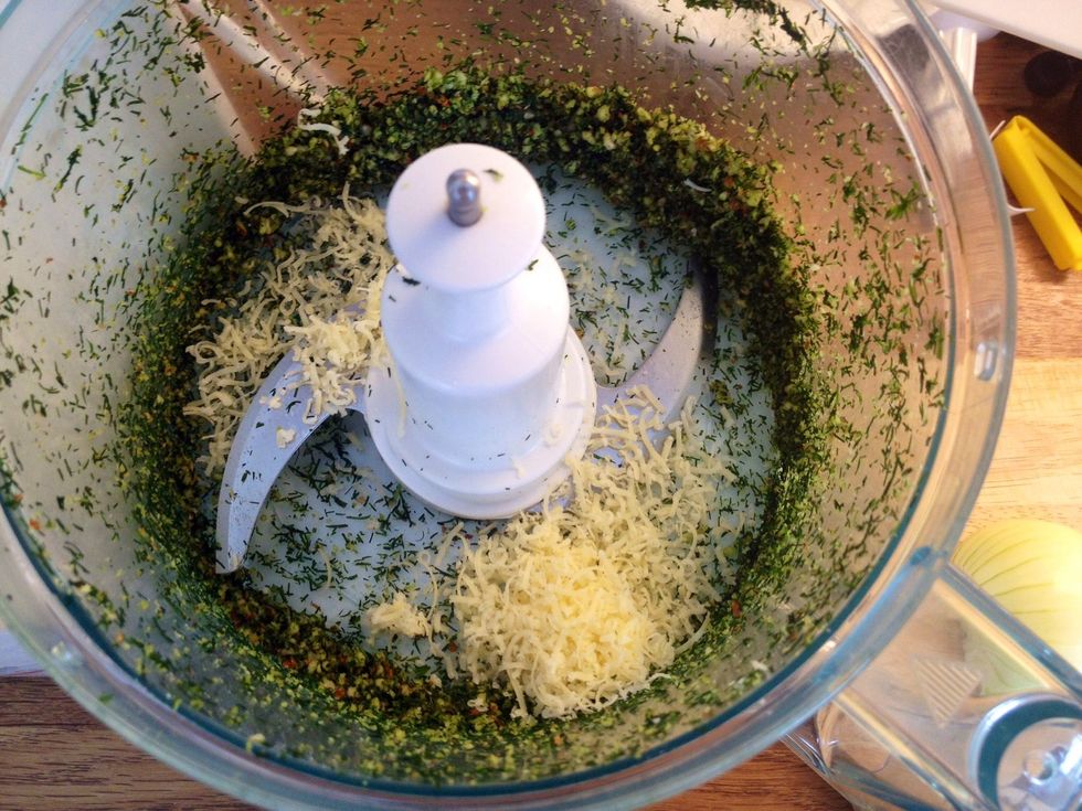 Then add the (grated) cheese. Mix again and then add the oil. Stir and move to a container.