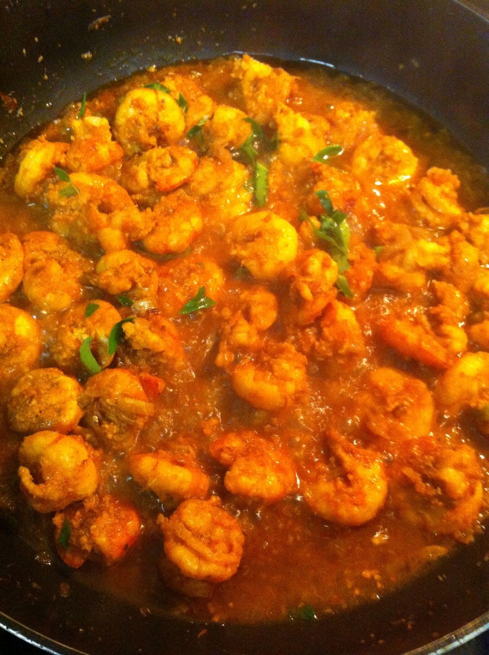 Then add the marinated shrimps to the onions along with curry leaves fry them little for 2 mins then add little water to it and cook by covering with lid.