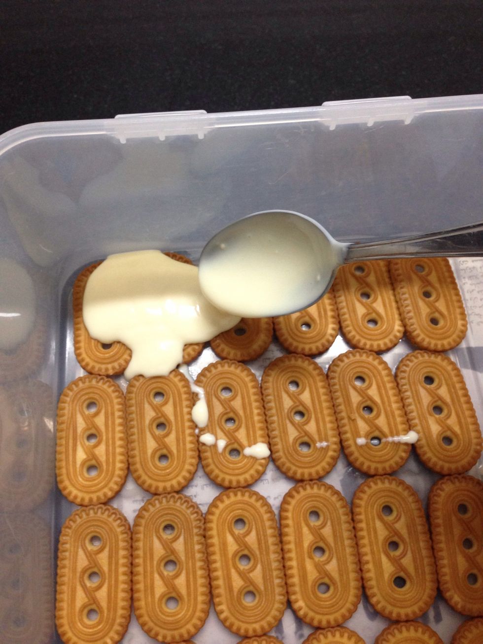 Then add the mixture on top of them and repeat until you make about 3 layers of biscuits covered by the mixture