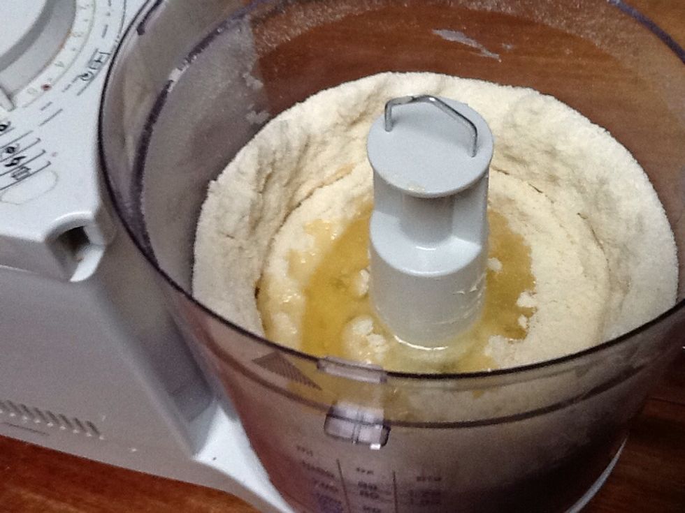 Then add the oil and mix it again until its a crumbly dough
