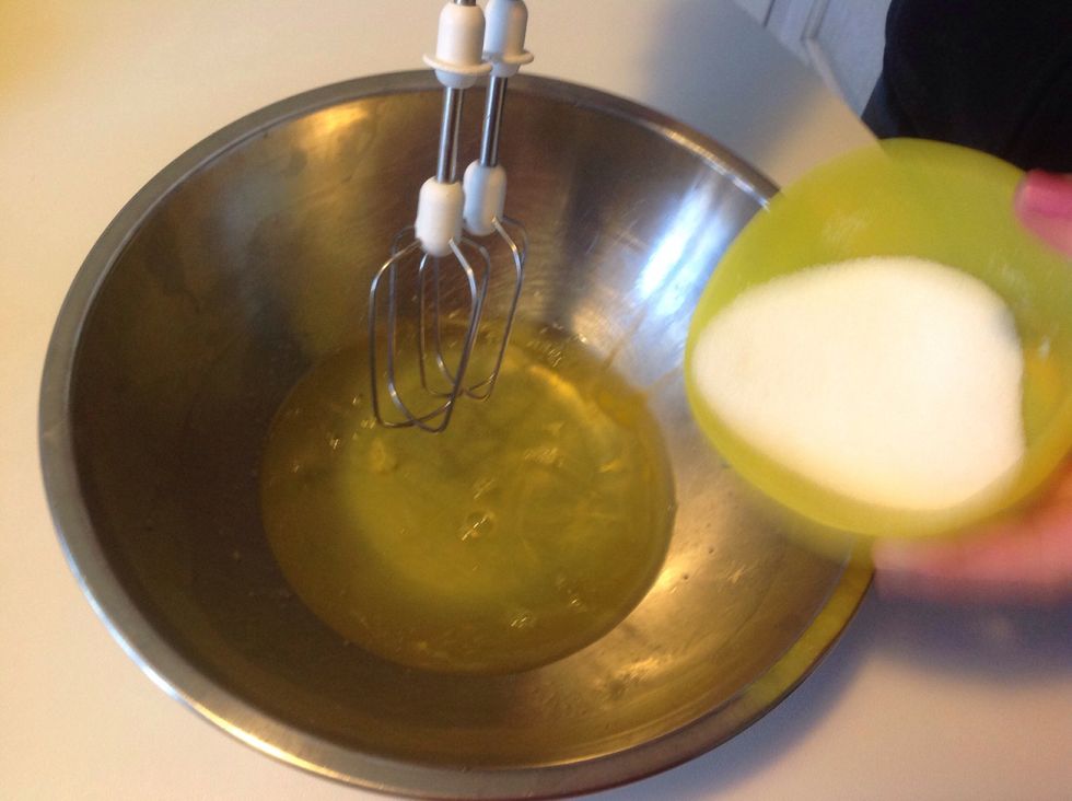 Then, add the other half of sugar to egg whites,
