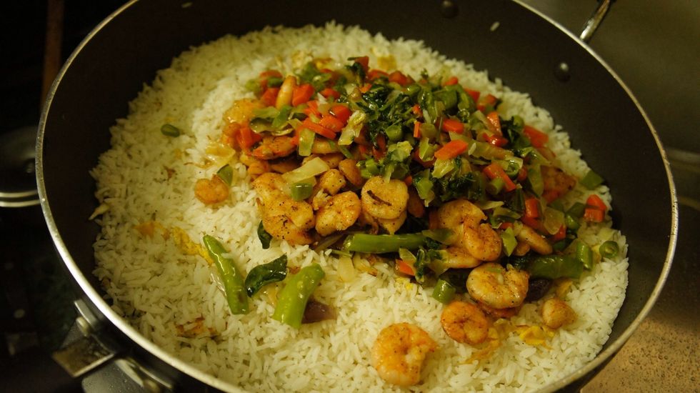 Then add the remaining fried mixture which was kept aside...( fried vegetables, fried onions, chillies and curry leaves and Fried Prawns)