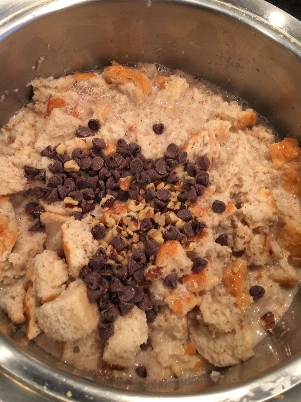 Then add the second 3 cups of soy milk mixture. Let it soak in for five minutes pressing it down with the spoon as you wait.