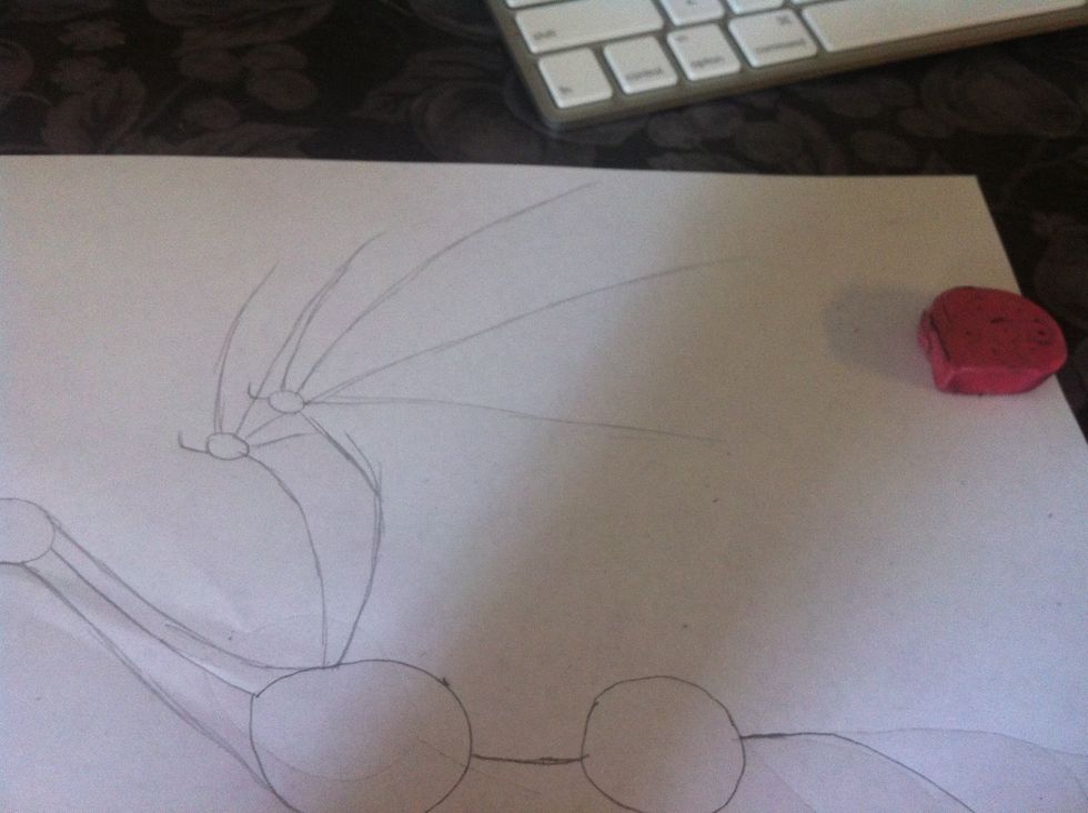 Then add the sketch of the wing slightly below the neck