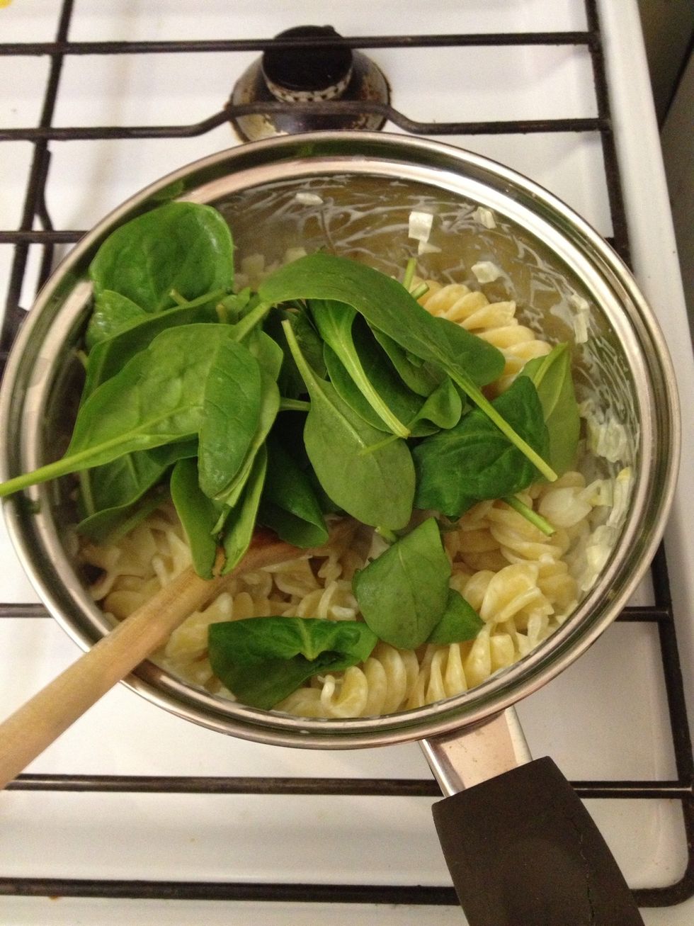Then add the spinach. Stir again.