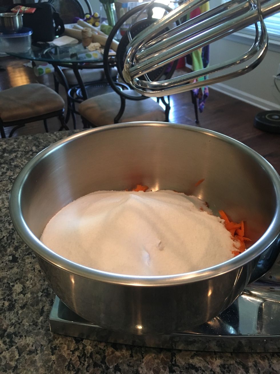 Then, add the sugar to the mixing bowl with the previous 5 ingredients.