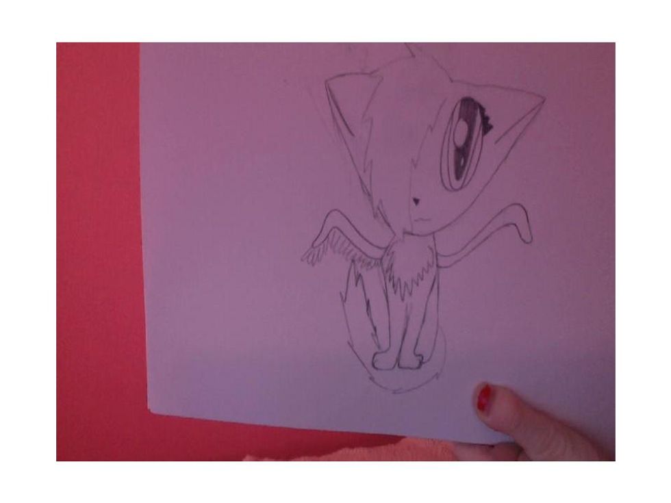 Then add the tail and wings. Add feathery u- shaped shapes all around the base of the wing to bring the texture