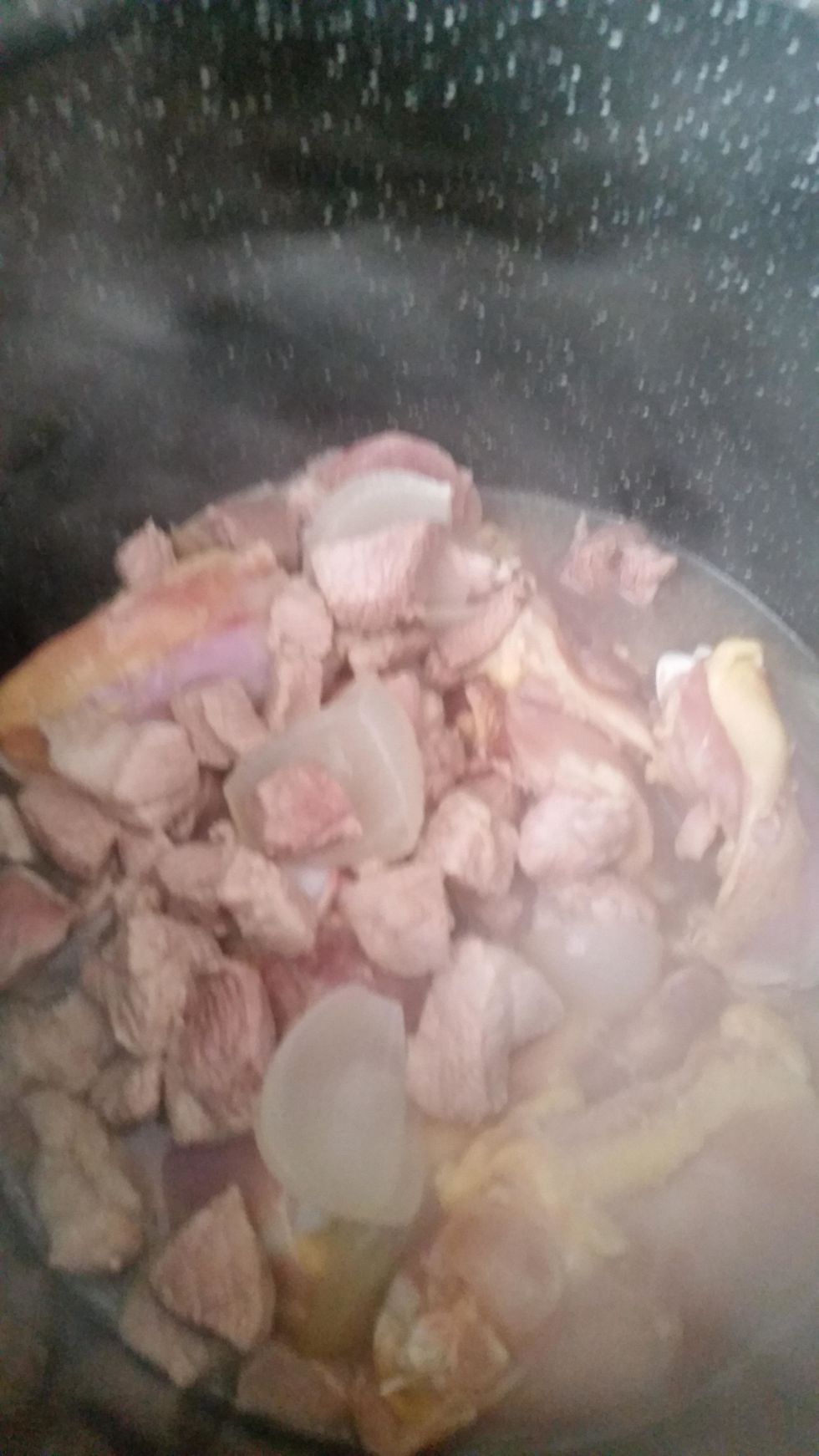 Then add the thighs to the pot. *NOTE* I was using the wrong pot, so I moved everything into a different one. Stir it up, add the 1 Tsp of garlic and cover. Cook for 30 min. Stirring occasionally.