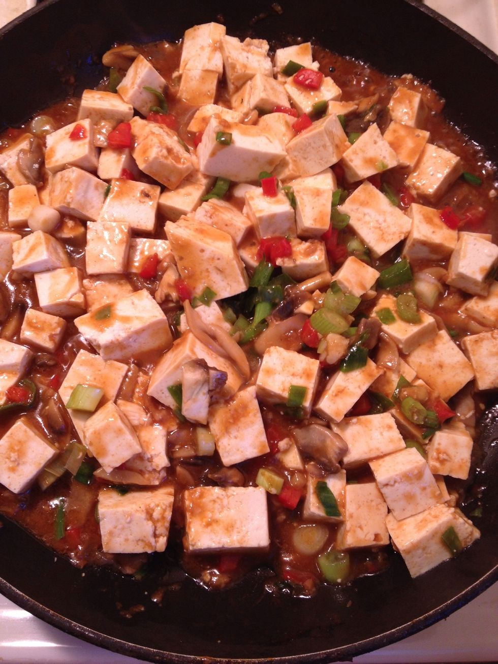 Then add the tofu (use the soft tofu rather than hard-it tastes better! ) and the green scallion. Be sure to prepare the tofu all chopped in cubes. You could adjust the size of the cubes as you wish.