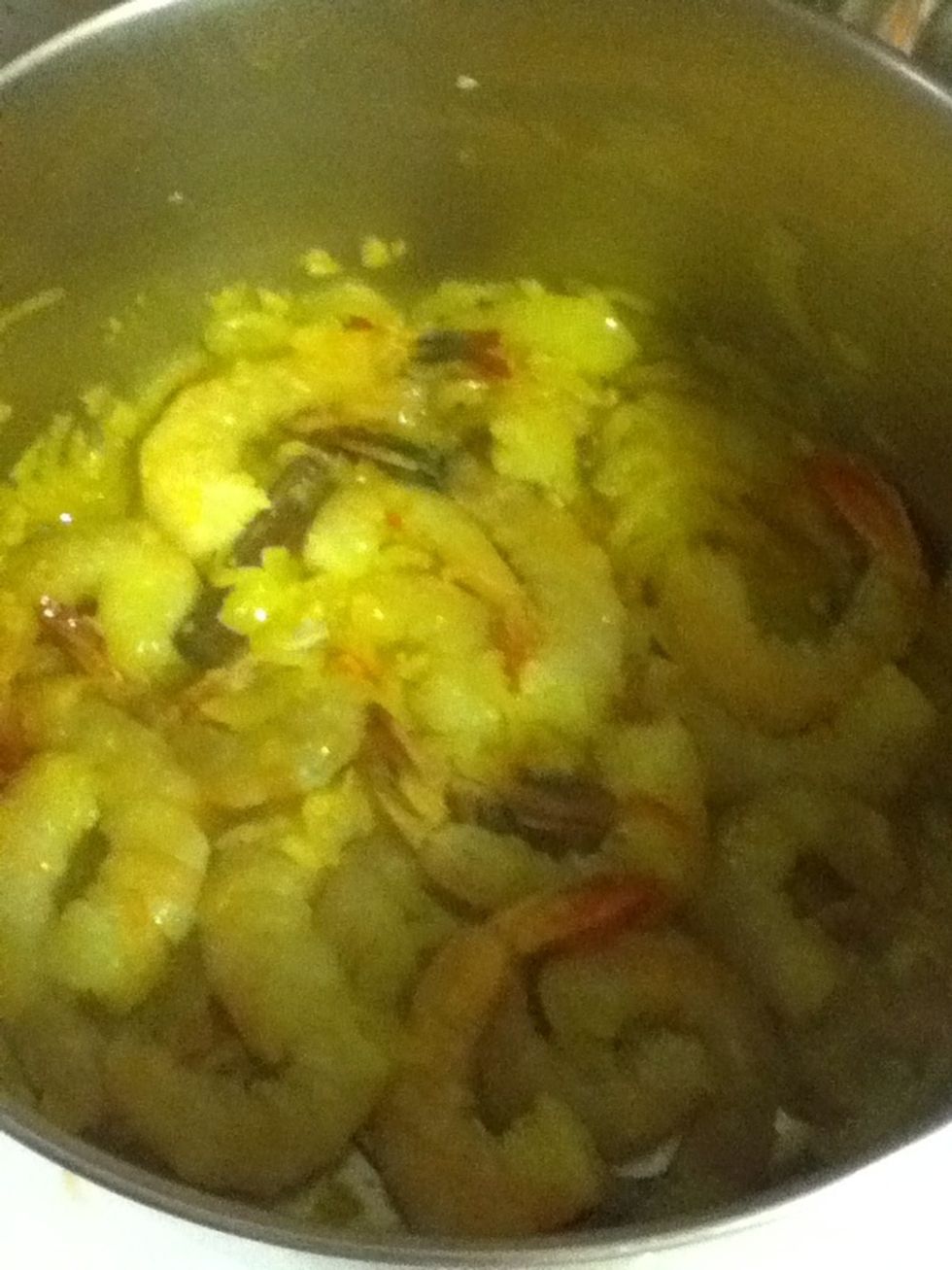 Then add those shrimp and stir fry 'em! Make sure they all get in contact with the hot pan. They're done when they're all pink (but not bright pink).