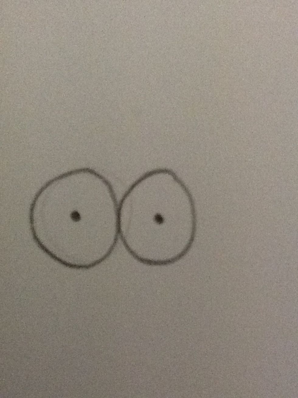 Then add two dots. This will be the eyes of your cartoon character.