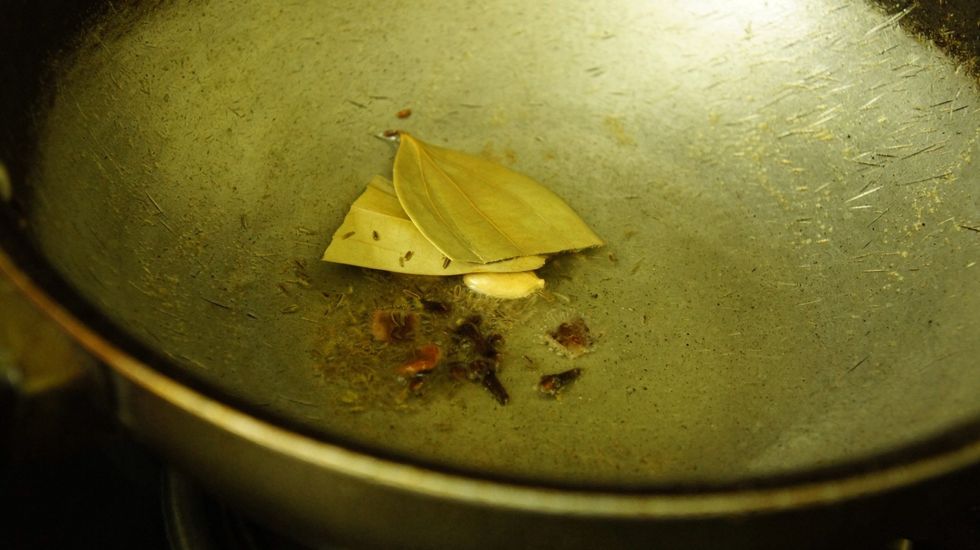 Then add whole garam masala