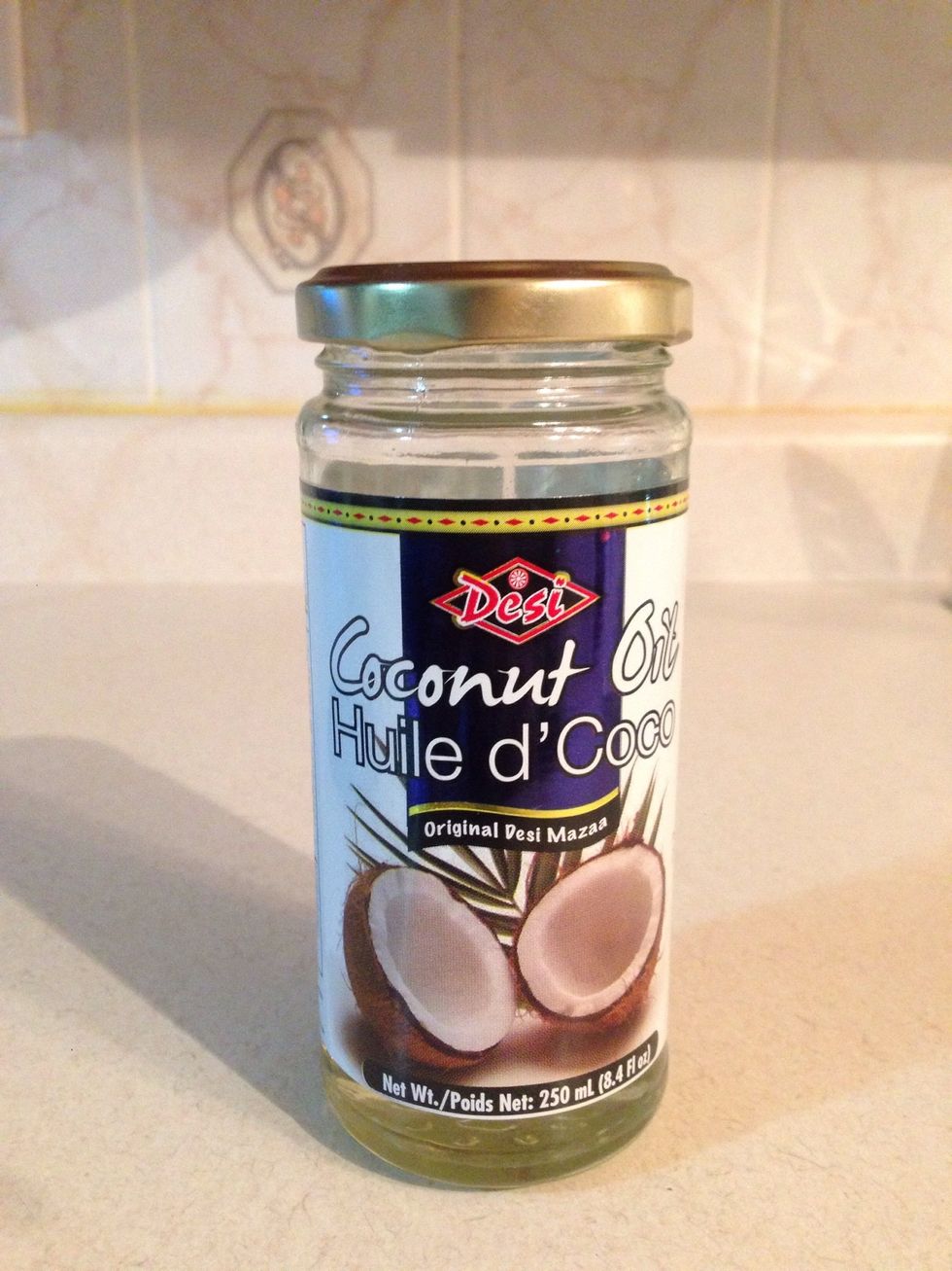 Then, add your coconut oil all over your kale just enough to cover each leaf, ( not too much )