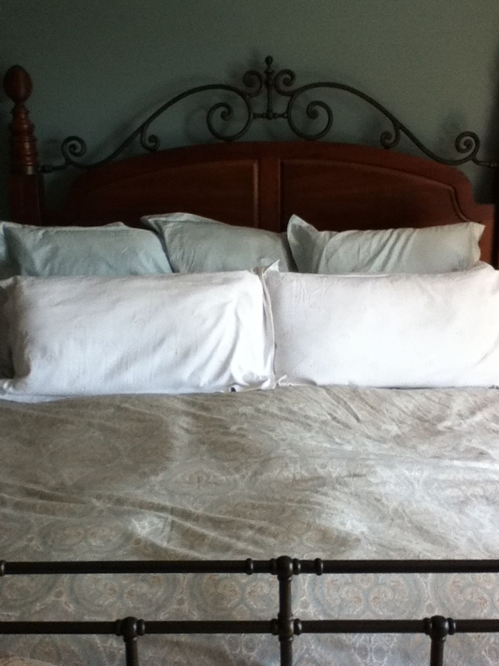 Then. Add your decorative pillows in front of the others. You should take these off when you sleep so the font get messed up