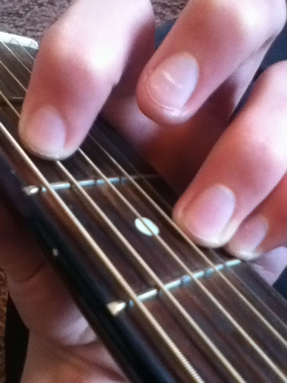 Then add your first finger on the fifth sting, second fret.