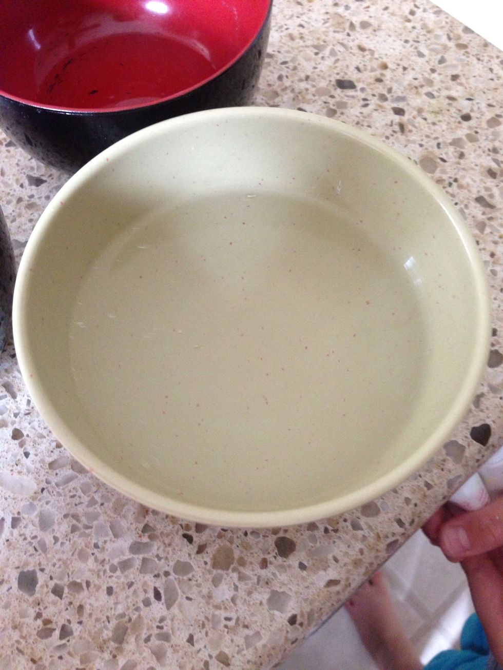 Then add your hot water from the boiling eggs you made up until the middle of your bowl.