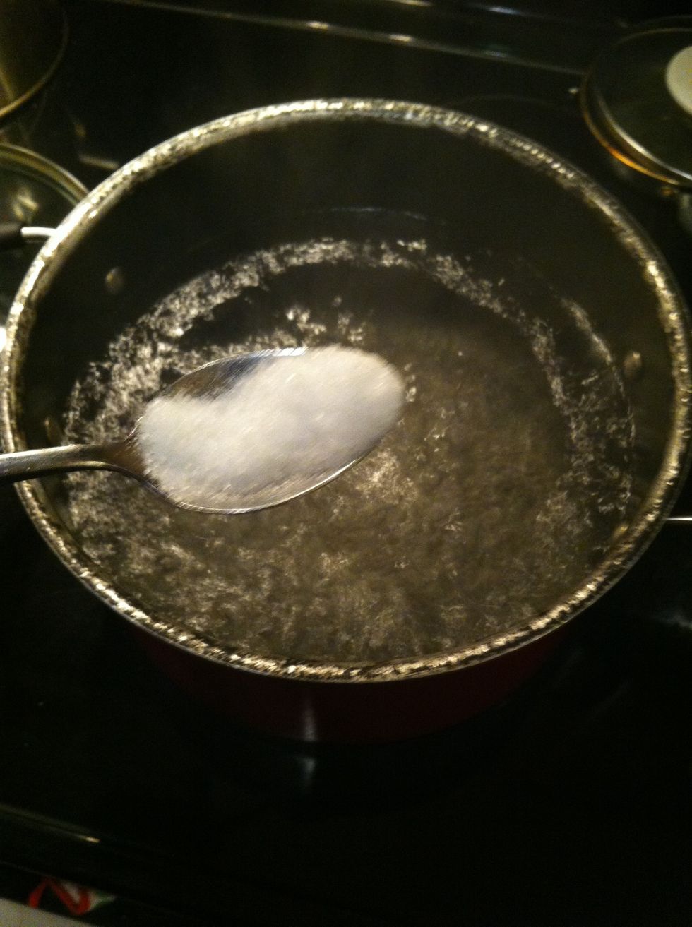 Then after the water boils put a spoon of salt into the pot
