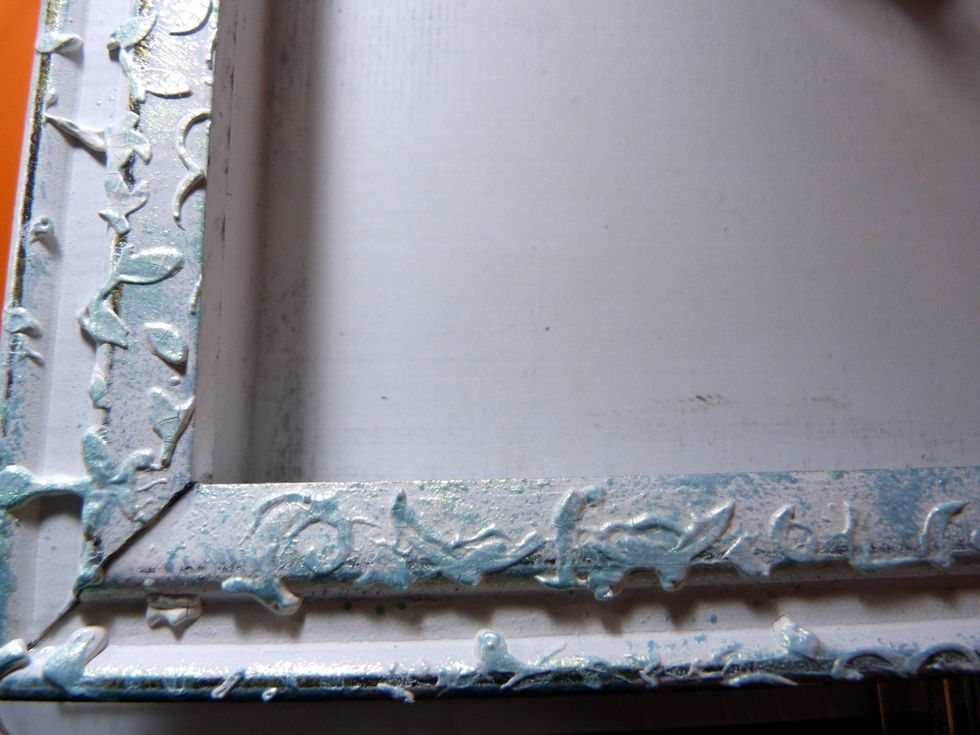 Then again when the texture paste is dry, dab the Art Alchemy paint over it again.