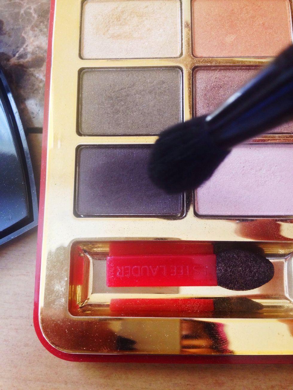 Then apply a dark chocolate brown shadow to the outer v