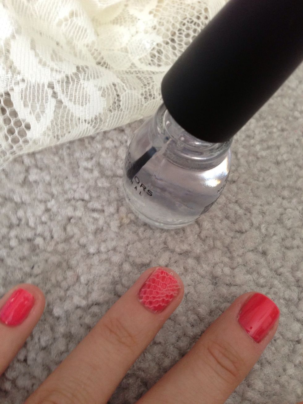 Then apply a layer of clear nail polish