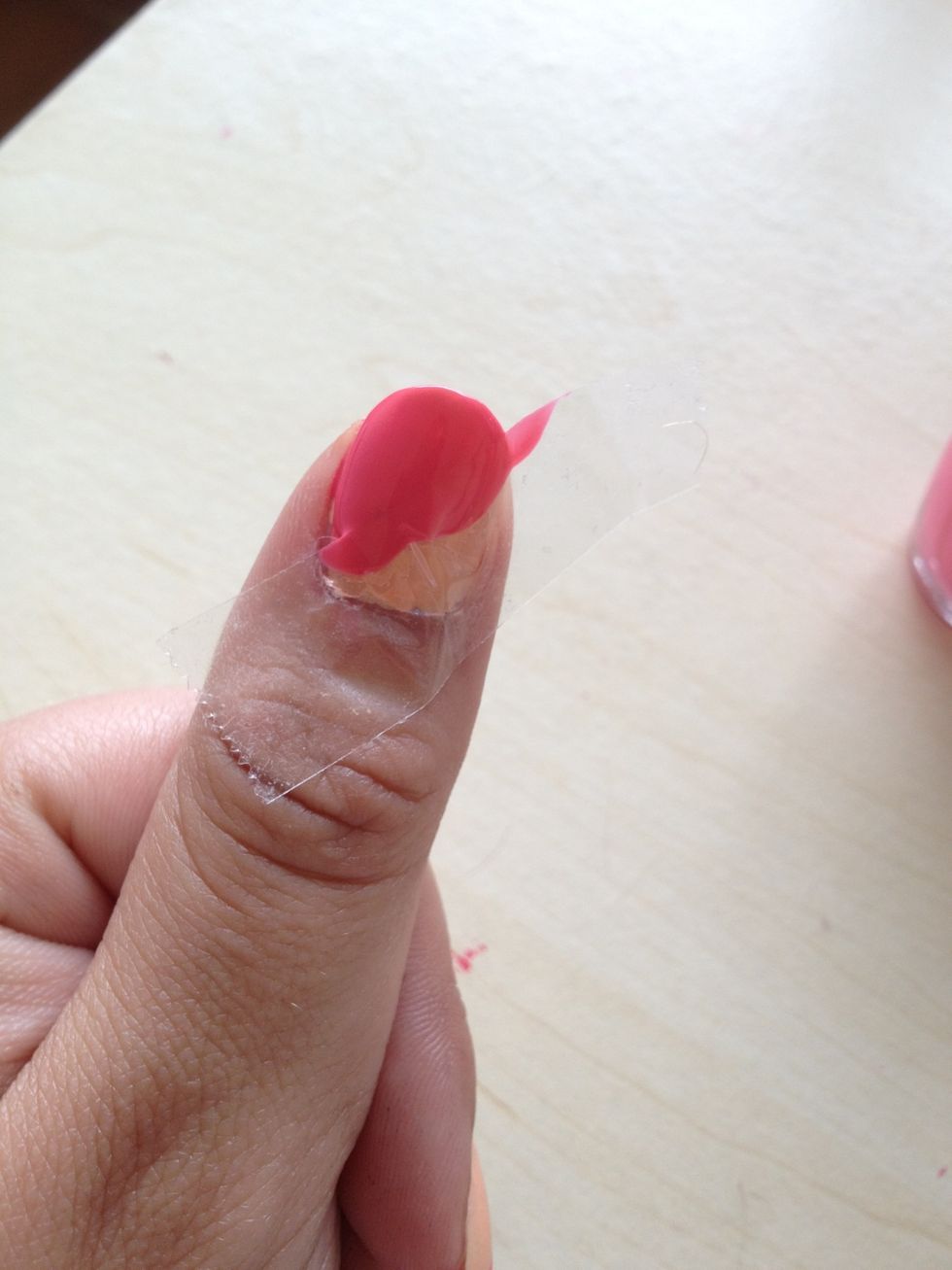 Then, apply the darker nail polish on the uncovered part of your nail. Apply freely; the tape will care of everything :) !
